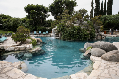 Wealthy next door neighbour is buying Playboy mansion